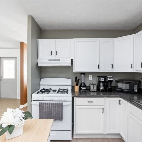 Kitchen: Modern design meets functionality with bright spaces and sleek appliances for culinary creativity!