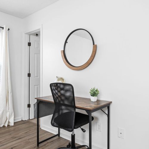 Inviting working table and chair, providing a dedicated space for productivity and comfort.