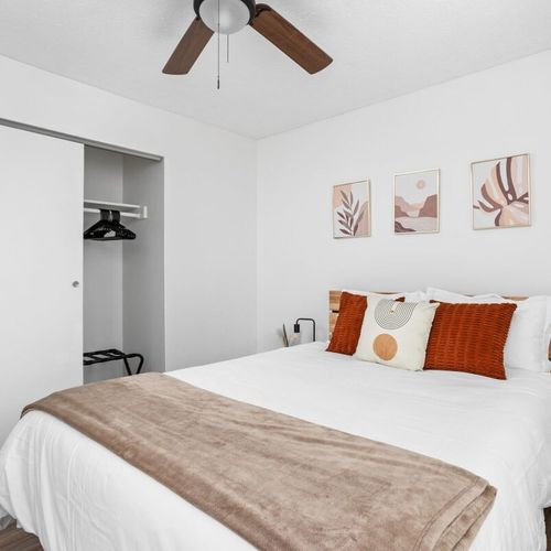 A queen bed and the convenience of a closet in this inviting bedroom.