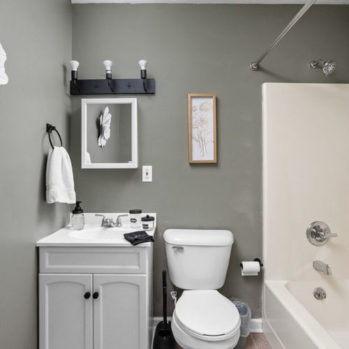 Bathroom Retreat: Refresh in this stylish bath featuring modern decor and essential amenities!