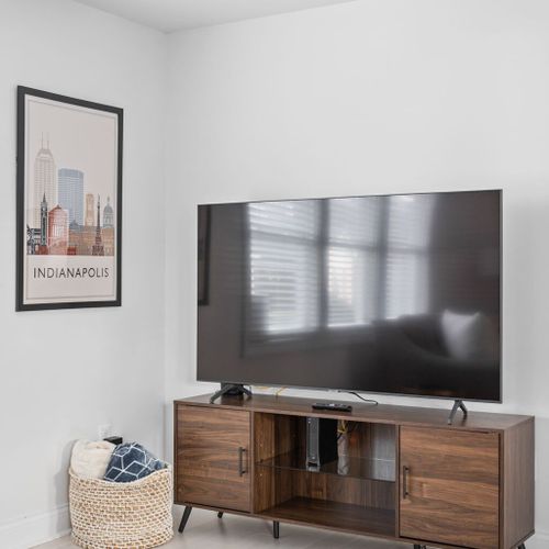 Living Room: Gather around the sleek TV for movie nights and fun-filled game sessions!