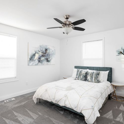 Bedroom: Relax in style with an elegant bed, artistic decor, and bright natural light!