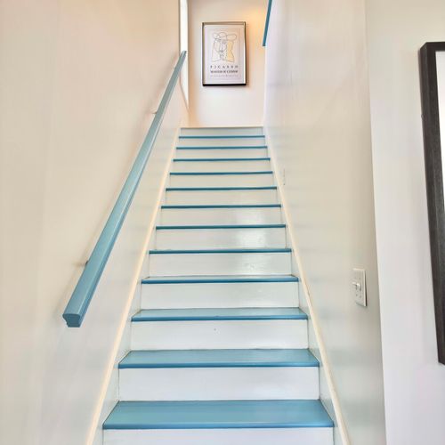 Stairway to Adventure: Vibrant blue accents lead you to your sunny retreat above!