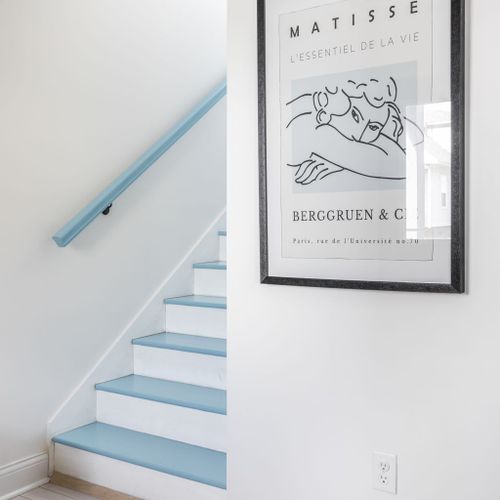 Stairway to Art: Bright blue accents and iconic Matisse print enhance your stay!