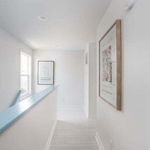 Hallway: Bright and airy space adorned with art, leading you to your next adventure!