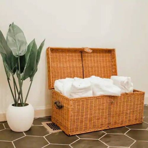 Towels are neatly placed in the basket for your convenience. Feel free to use them as needed during your stay.