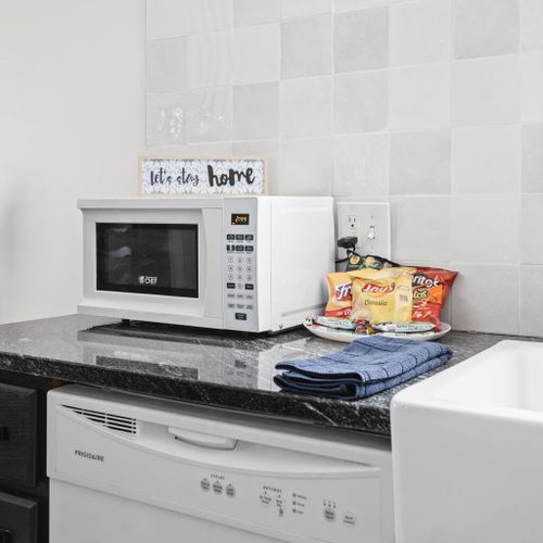 Help yourself to the microwave for any heating needs, and we've also provided chips for your snacking pleasure.