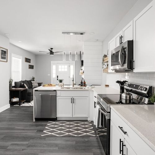 Kitchen: Modern kitchen space with sleek appliances, stylish decor, and inviting natural light!