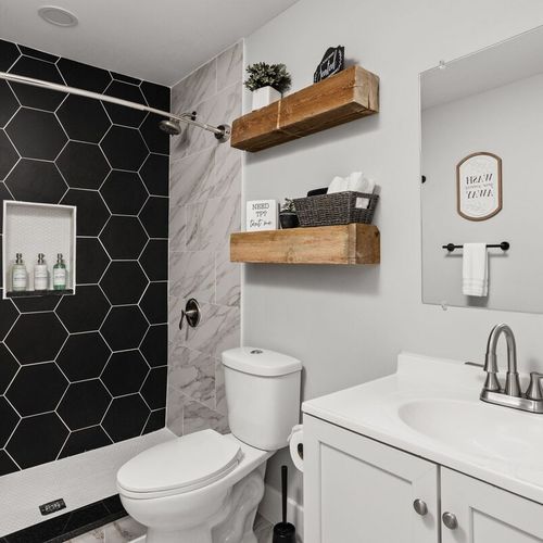 Bathroom 2: Modern design with sleek finishes and stylish amenities for a refreshing stay!