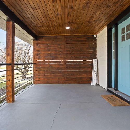 Exterior: Step into modern elegance with stylish architecture and inviting porch views!