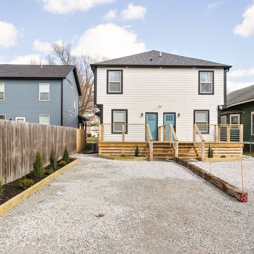 Backyard: Enjoy sunny days on the inviting deck, surrounded by a spacious yard for fun! Room for up to two cars to park, please note this is a duplex and only one side can be used!
