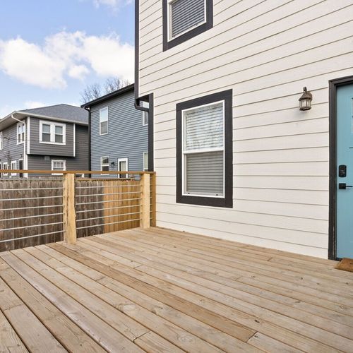Experience the charm of our open back porch, offering a delightful and relaxing outdoor space.