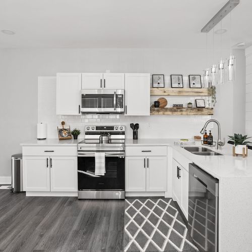 Kitchen: Bright, modern kitchen equipped for culinary adventures, stylish decor awaits!