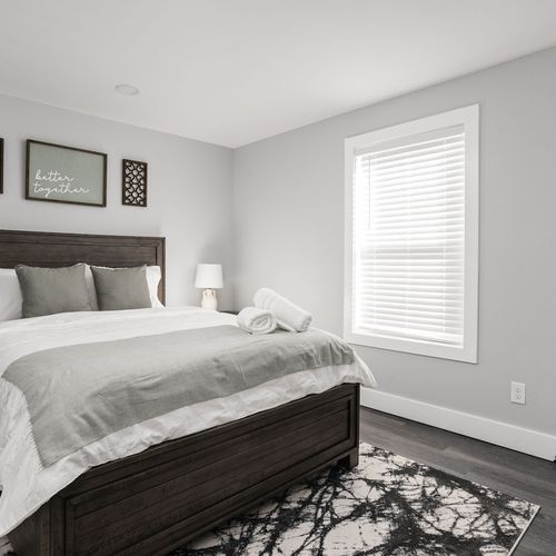 Bedroom: Unwind in style with a plush bed, serene decor, and natural light flooding in!