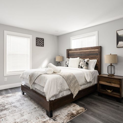 Bedroom Retreat: Bright space with plush bedding, decorative accents, and modern amenities await!
