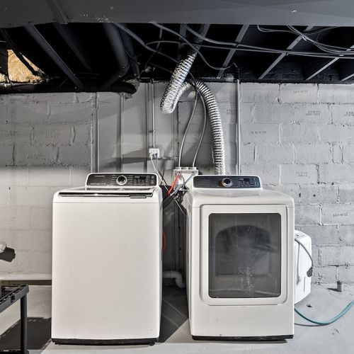 Laundry Room: Convenient space with modern washer and dryer to keep your clothes fresh and clean!