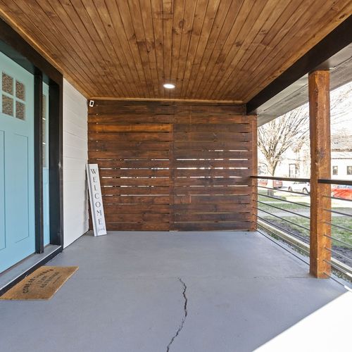 Front Porch: Invite tranquility with a charming entryway and rustic wood accents—your getaway awaits!