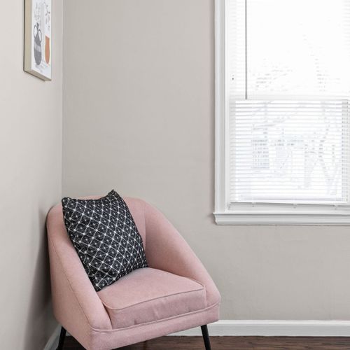 Experience comfortable seating in the bedroom, creating a cozy and inviting space for relaxation.