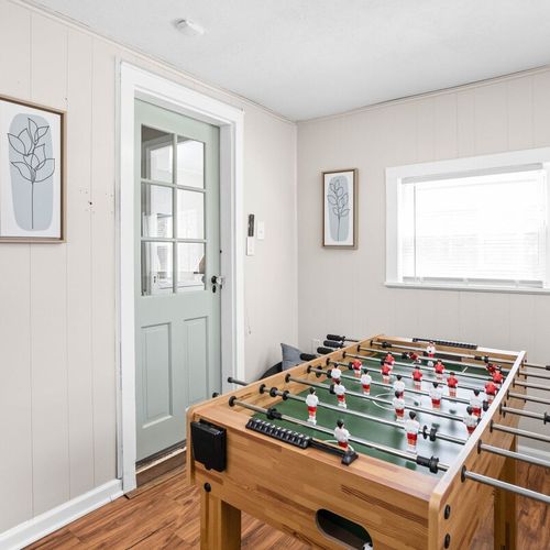 Enjoy a game of foosball on our gaming table and have fun in our simply decorated yet elegant gaming room.