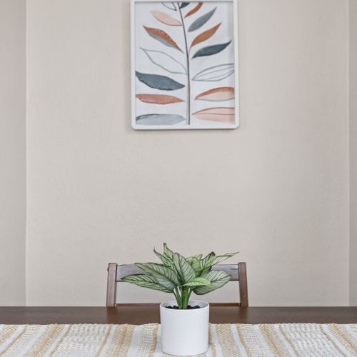 Adorned with a charming flower on the table and a simply elegant decor framed on the wall, our space exudes a touch of sophistication and warmth.