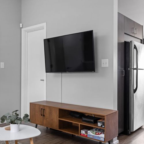Watch TV with ease, and underneath, you'll find a media cabinet for your storage needs.