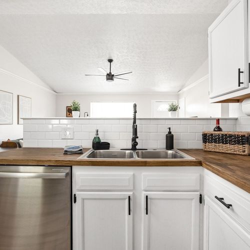 We have a sink, dishwasher, cabinets, paper towels, and essential kitchen items in our kitchen for your convenience. Please feel free to utilize these amenities throughout your stay.