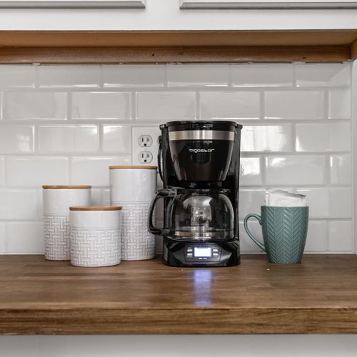 Begin your day with a moment of tranquility – our coffee station is ready with all the essentials. Take a moment to relax, savor a cup of coffee, and feel at home.