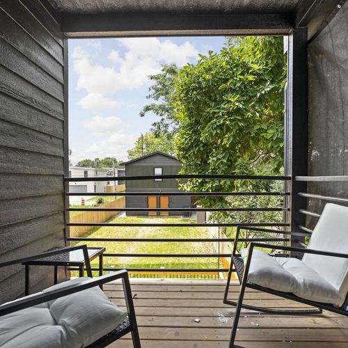 Settle into this comfortable seat and enjoy the charming view from this adorable space.