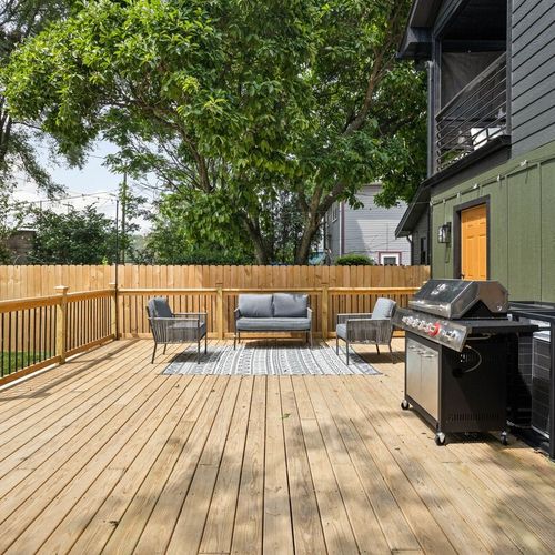 Unwind in the comfortable seat on our spacious back porch, offering a serene and inviting retreat.