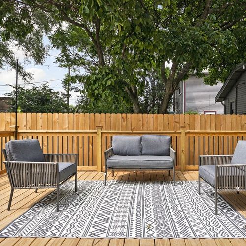 Unwind in the comfortable seat on our spacious back porch, offering a serene and inviting retreat.