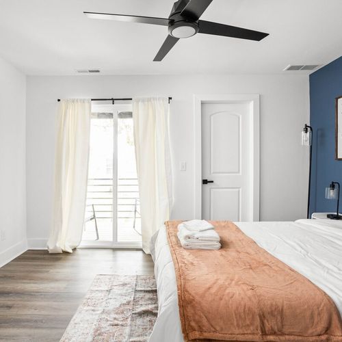 Prepare to be amazed by the luxury of our meticulously designed bedroom, crafted for a cozy and comfortable night's rest. Enjoy the entertainment from the TV, the natural light from the window, and the artistic touch of a framed wall decor.