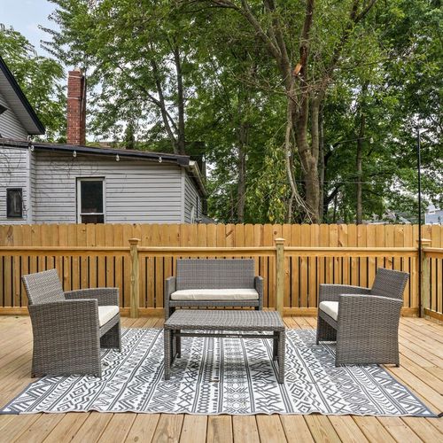 Unwind in the comfortable seat on our spacious back porch, offering a serene and inviting retreat.