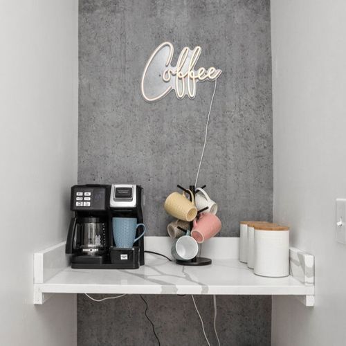 Indulge in the charm of our delightful coffee corner, lovingly crafted for your moments of coffee creation and savoring.