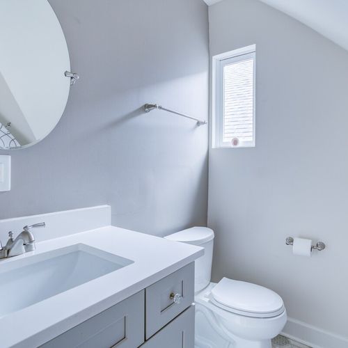 Feel comfortable in this elegant, shining bathroom, equipped with fresh towels, shampoo, conditioner, and body wash for your convenience.