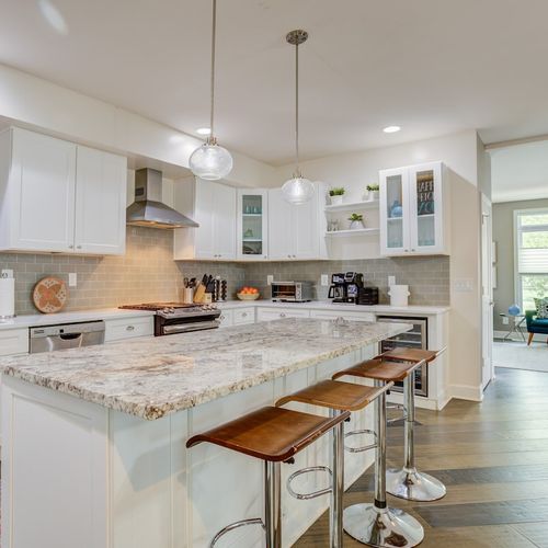 Step into a kitchen where cleanliness meets elegance. The beautiful countertop adds a touch of sophistication, making it a space that's as functional as it is visually stunning.