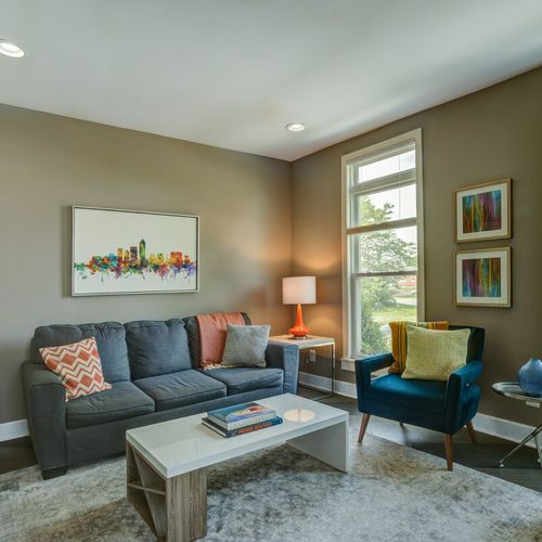 Relax and smile in this inviting hangout area with soft, beautiful sofas and couches—a perfect spot to read books and unwind.