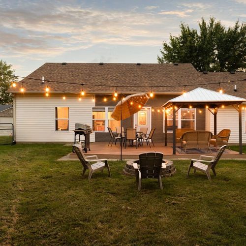 Prepare for an awe-inspiring revelation. The breathtaking vista that unveils as you enter is reminiscent of a natural masterpiece, complemented by an outdoor dining table and firepit.