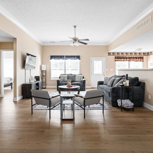 A comfortable living room, soft seating, and a welcoming atmosphere, it's the ideal space for relaxation, socializing, and making lasting memories.