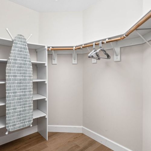 an ironing area and a spacious closet for your convenience.