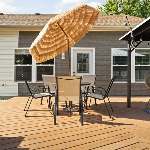 Dine in style with a beautiful outdoor dining table, creating a charming and inviting atmosphere for your gatherings.