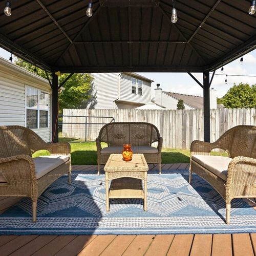 Take a moment to relax and unwind in our outdoor space – we've set up comfortable furniture just for you.