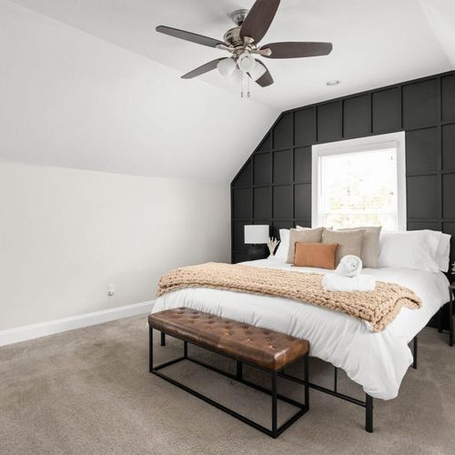 Experience the comfort of our bed adorned with pillows, complemented by an elegant bed bench, a convenient bedside table, and a mirror. Clean, fresh, and smooth towels are also provided for your ultimate convenience.