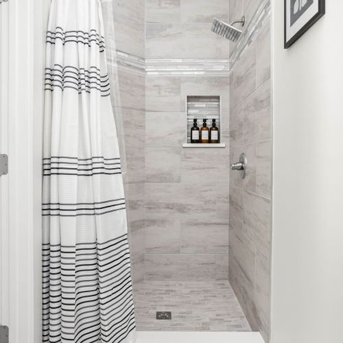 Step into our tiled, clean shower, fully equipped with complimentary shampoo, conditioner, and body wash for a refreshing and luxurious bathing experience.