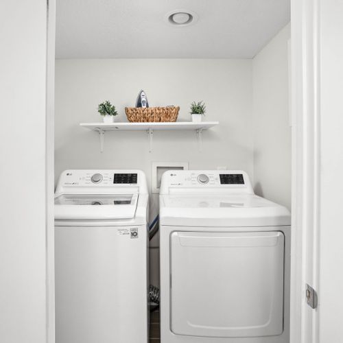 Explore our charming laundry area, where functionality meets cuteness for a delightful and practical space.