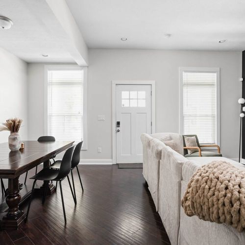 From the dining table, you have a view that extends to the right, where a comfortable sofa awaits for seating, creating the perfect spot to enjoy TV entertainment.