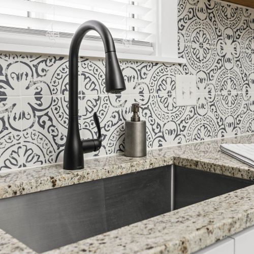 The kitchen's allure with an amazing faucet and sink, adding both style and functionality to this essential space