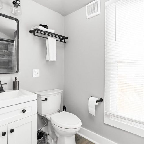 Full bathroom equipped with a mirror, vanity, closet, fresh towels, and all the bathroom essentials you need for a comfortable and convenient stay.