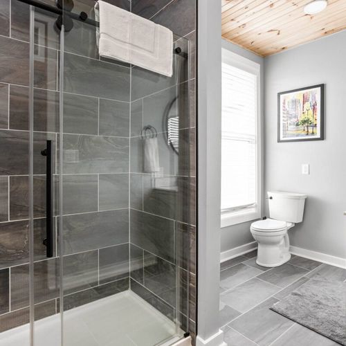 Well-appointed bathroom featuring a closet, mirror, sink, and a thoughtful array of amenities and essentials for your comfort and convenience.