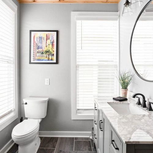 Well-appointed bathroom featuring a closet, mirror, sink, and a thoughtful array of amenities and essentials for your comfort and convenience
