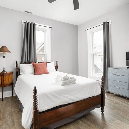 Cozy haven with a comfortable bed, bedside table, and lamp for added convenience. Complete the retreat with a dresser and TV.